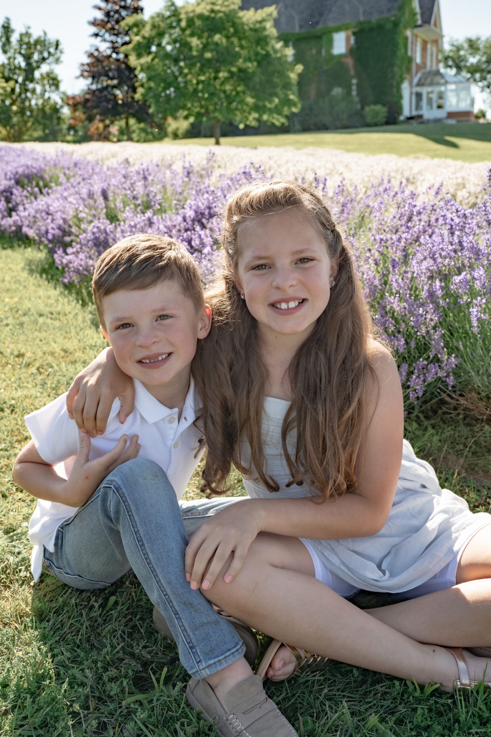 Siblings in lavender field — photographed by Alliston and Barrie maternity, newborn, and family photographer.