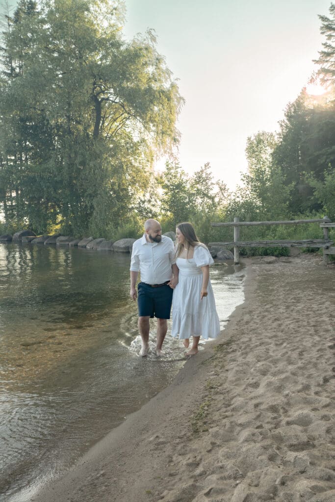 Couple walking on beach during Barrie family photography session